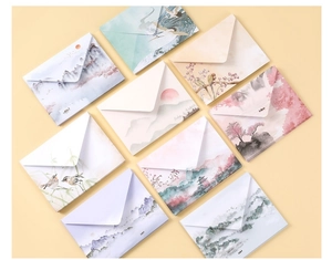 Detail of premium envelopes with traditional Chinese ink landscape and crane illustrations