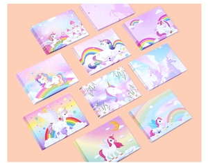 Flat lay of 10 unicorn themed stickers with rainbow and star patterns in pastel colors