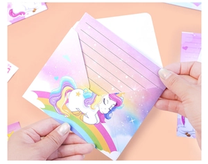 Detailed view of the unicorn themed stationery set with illustrated envelope and paper