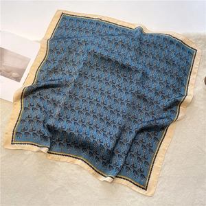 Detailed pattern of luxury navy silk scarf with vintage equestrian stirrups and chains