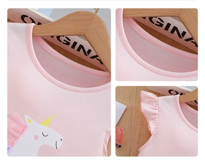 Detail of pink girls' top with unicorn print and delicate ruffled sleeve texture