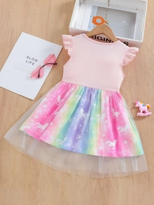 Pink flutter sleeve girl dress with rainbow mesh skirt and unicorn print on wood background