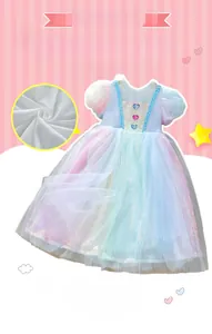 Detail of toddler pink dress featuring colorful heart buttons and rainbow organza mesh