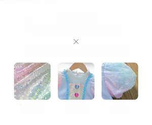 Detail of pink princess dress featuring sequined fabric and heart-shaped gemstone