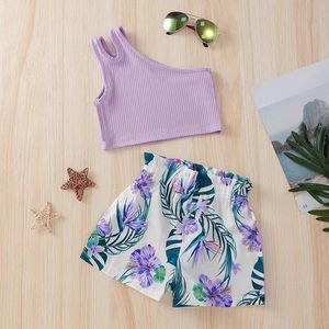 Detail of girls one-shoulder lavender ribbed top and tropical flower print shorts