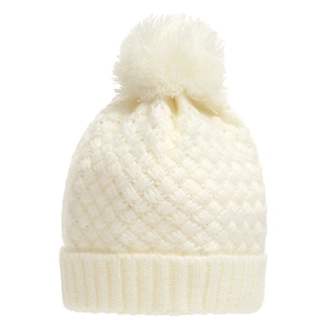 Detail of cream knit beanie with fluffy pompom showing thick texture and ribbed cuff