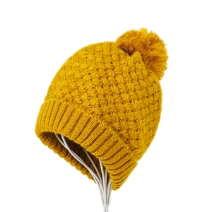 Winter ginger knit beanie hat with fuzzy pompom on display stand for women