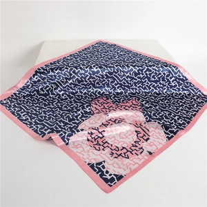 Navy and pink square silk scarf with abstract letter print and floral corner patterns