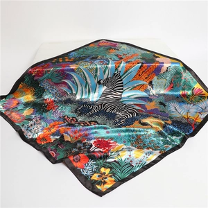 Fashionable silk scarf featuring a zebra and tropical jungle print in vibrant colors