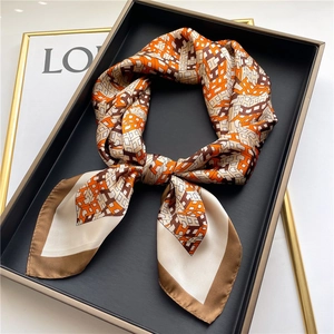 Silk-like square scarf featuring geometric H-pattern and contrasting borders in orange