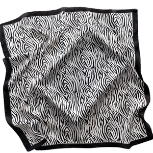Classic black and white zebra pattern square silk scarf with elegant satin finish