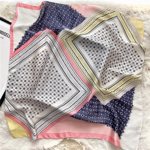 Detailed view of the silk lace paisley square scarf with vintage geometric patterns