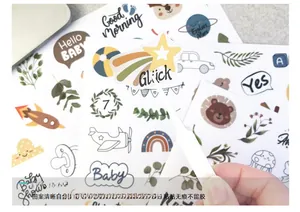 Close-up of waterproof baby milestone stickers with cartoon stars and Morandi tones