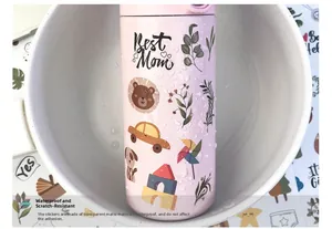 Waterproof cartoon stickers for baby milestones on pink bottle with water droplets