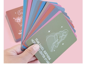 Handheld view of bohemian pregnancy affirmation cards with female line art and quotes