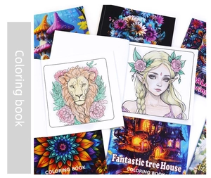 Close-up of coloring book inner pages with intricate black and white fantasy illustrations