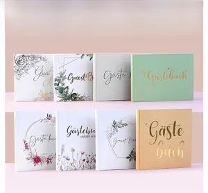 Detailed collection of wedding guest books featuring foil stamping and floral linen covers