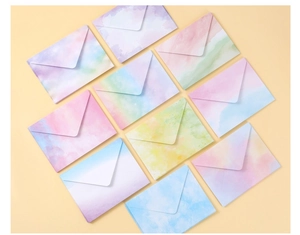 Detailed view of macaron gradient watercolor envelopes with V-shape flap design