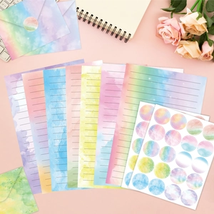 Dreamy watercolor gradient stationery set with envelopes and seals on pink background