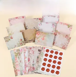 Detailed set of vintage floral stationery including envelopes, paper and wax seal stickers