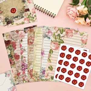 Vintage floral stationery set with rose envelopes and wax seal stickers on pink background