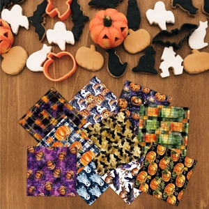 Halloween decorative paper with pumpkin, ghost, and bat patterns on wood background