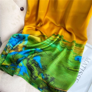 Close-up of landscape print silk shawl with artistic mountain scenery and smooth texture