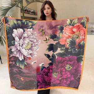 Detail of silk satin scarf featuring traditional crane and peony floral pattern