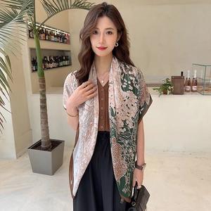 Detail of elegant vintage floral silk scarf with dark green and coffee brown patterns
