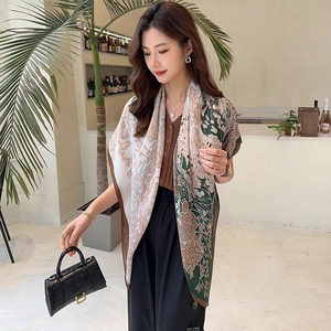 Detail of vintage floral print oversized shawl featuring deep green and cream color blocking