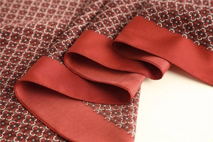 Detail of vintage floral print silk scarf with fine rolled edges and soft silk sheen