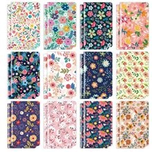Set of 12 mini notebooks featuring diverse floral tie-dye patterns in a flat grid layout