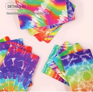 Detail of colorful tie-dye mini notebooks featuring safe rounded corners and vibrant patterns