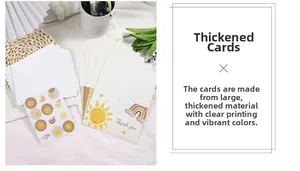 Detail view of boho thank you cards with sun illustrations and matching white envelopes