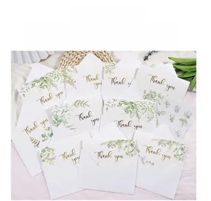 Macro detail of eucalyptus leaf thank you cards with envelopes and gold sealing stickers