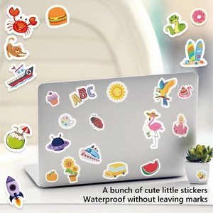 Waterproof cartoon stickers with cute animals and food on a silver laptop surface