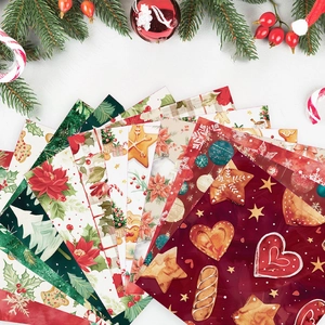 Christmas scrapbook paper set with 24 festive patterns like poinsettias and trees
