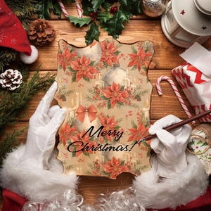 Macro shot of vintage Merry Christmas scrapbook paper with burnt edges and festive motifs