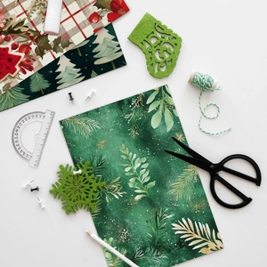 Christmas scrapbooking paper kit with festive patterns, green felt shapes and DIY tools