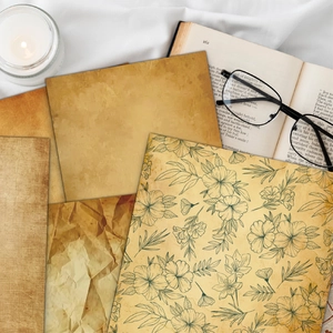 Macro view of vintage distressed paper set for scrapbooking with floral pattern and fiber texture