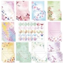 Flat lay of vintage floral stationery sets with botanical envelopes and seal stickers