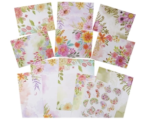 Detailed flat lay of floral stationery set featuring assorted flower patterns and stickers