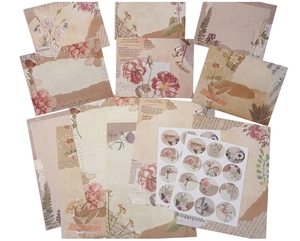 Macro detail of vintage watercolor floral writing paper and matching round sealing stickers