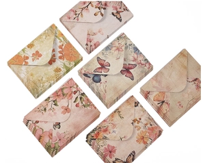 Close-up of vintage stationary set with six different floral and butterfly envelopes