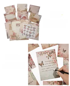 Macro shot of vintage floral stationery set with thick paper and botanical collage patterns