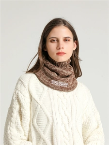 Detail of marled brown knit neck warmer featuring a HALOWINT lettered embroidery patch