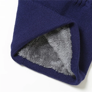 Detail of dark blue knit scarf with thick grey fleece lining for cold protection