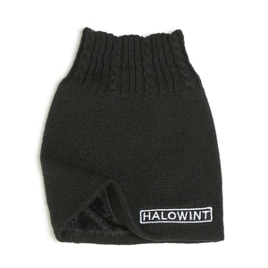 Detail of black cable knit neck warmer with thick fleece lining and white logo embroidery