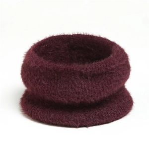 Detail of soft burgundy mohair-like neck warmer with fluffy plush texture and rich fibers