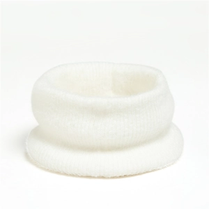 Close-up of white mohair knit neck warmer showing soft texture and vertical ribbed pattern